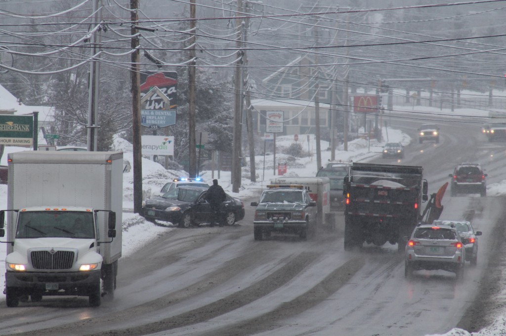 Rob Mitchell / Staff Photo Rutland Police responded to this car into a telephone pole on Woodstock Avenue in Rutland Wednesday morning, when a light snowfall made roads slippery.